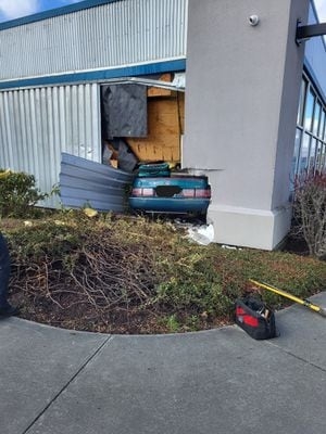 Driver pulled out of car after crashing into a building in Everett