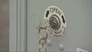 USPS worker robbed at gunpoint on job, suspect arrested