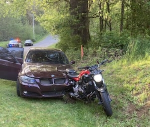 Car rear-ends motorcyclist, then runs them over in Thurston County