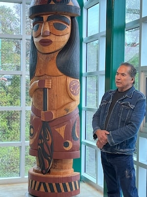 New Salish welcome figures greet ferry riders inside the Bainbridge Island walkway