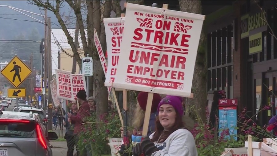 Striking New Seasons employees claim worker was fired for helping disabled person on break