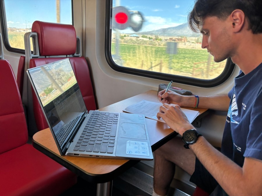 UNM engineering students take midterm exam on Rail Runner