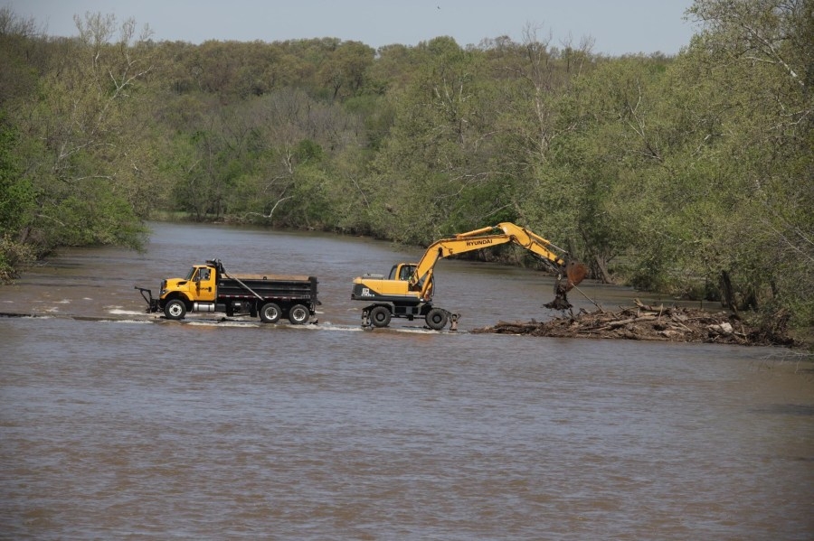 Flooding debris cleared from Shoal Creek bridge crossing