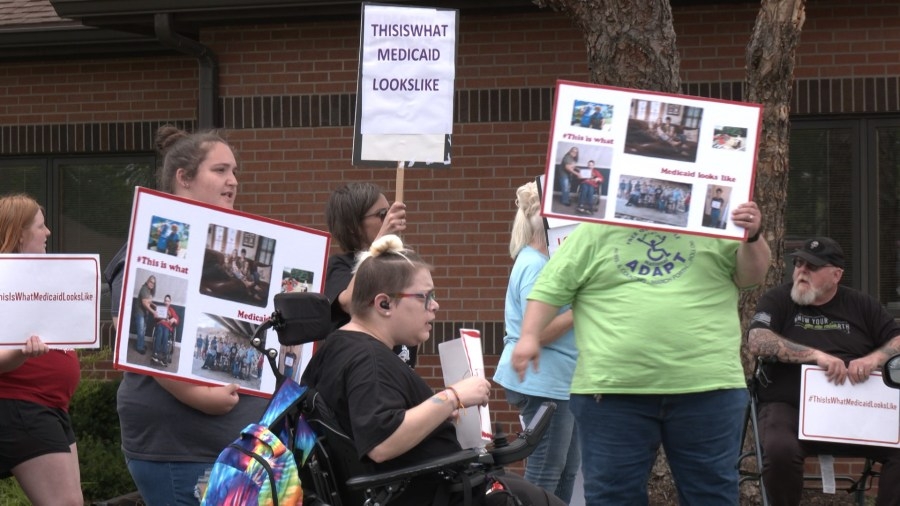 Activists protest possible Medicaid cuts outside KS Rep. Derek Schmidt's Topeka office