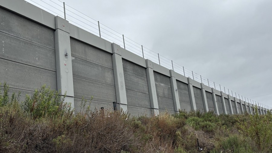 Emergency stabilization work underway on retaining wall along train tracks in Bay Ho