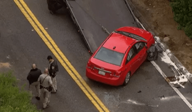 Vehicle overturns in Ramona after striking boulder in middle of road
