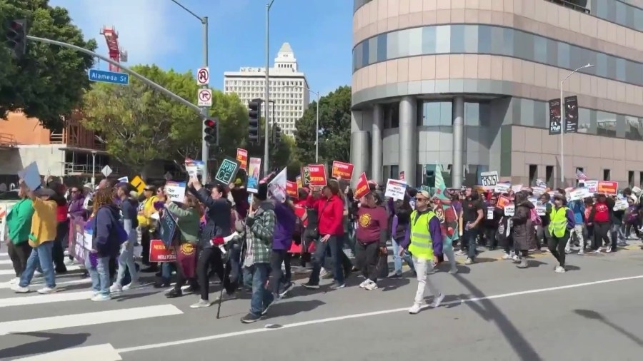 Demonstrators hold rally to protest Trump policies in downtown Los Angeles