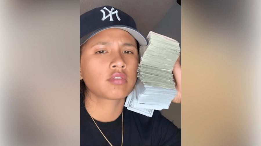 USPS worker who flaunted stacks of cash on social media admits to stealing checks from mail
