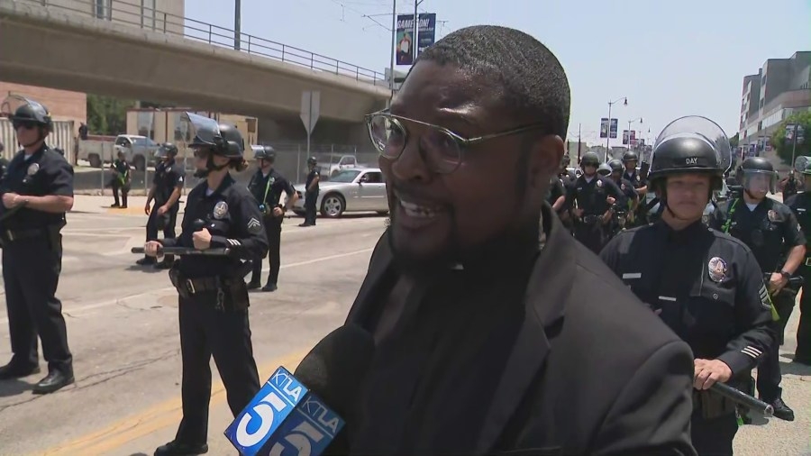 Clergy join protesters to keep the peace after weekend's destruction