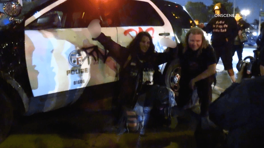 Chaos unfolds in downtown Los Angeles as large mob vandalizes police car, train, businesses