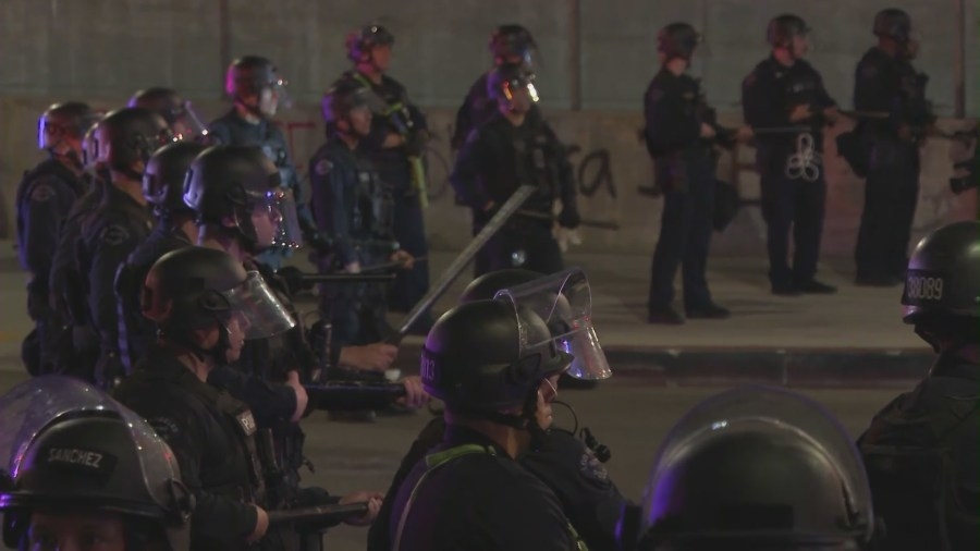 Flash-bangs, tear gas and arrests as ICE raids protests continue in Los Angeles