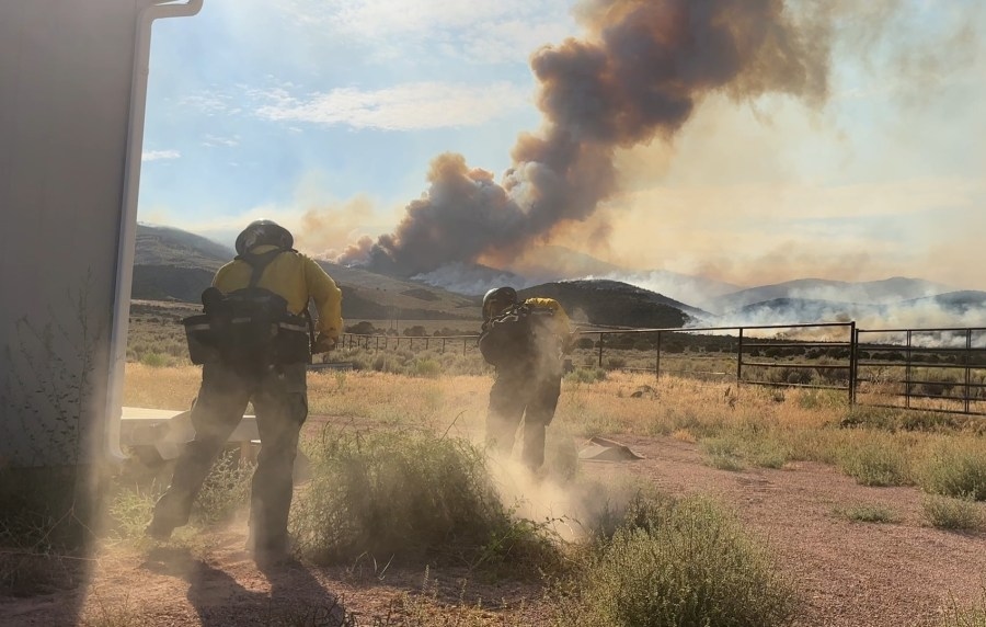 ‘This is a tough one': Gov. Cox visits crews fighting Monroe Canyon Fire, containment drops as fire passes 55,000 acres