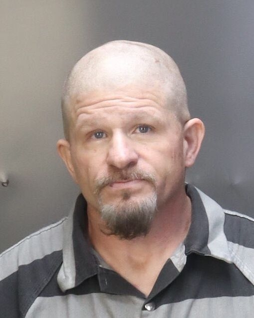 Mart man charged with holding knife to woman's throat, assaulting child