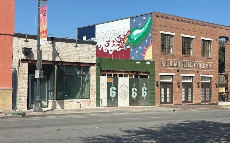 When will new businesses fill vacant buildings on Sixth Street?