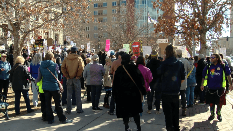 March protesting President Trump's agenda at City Hall