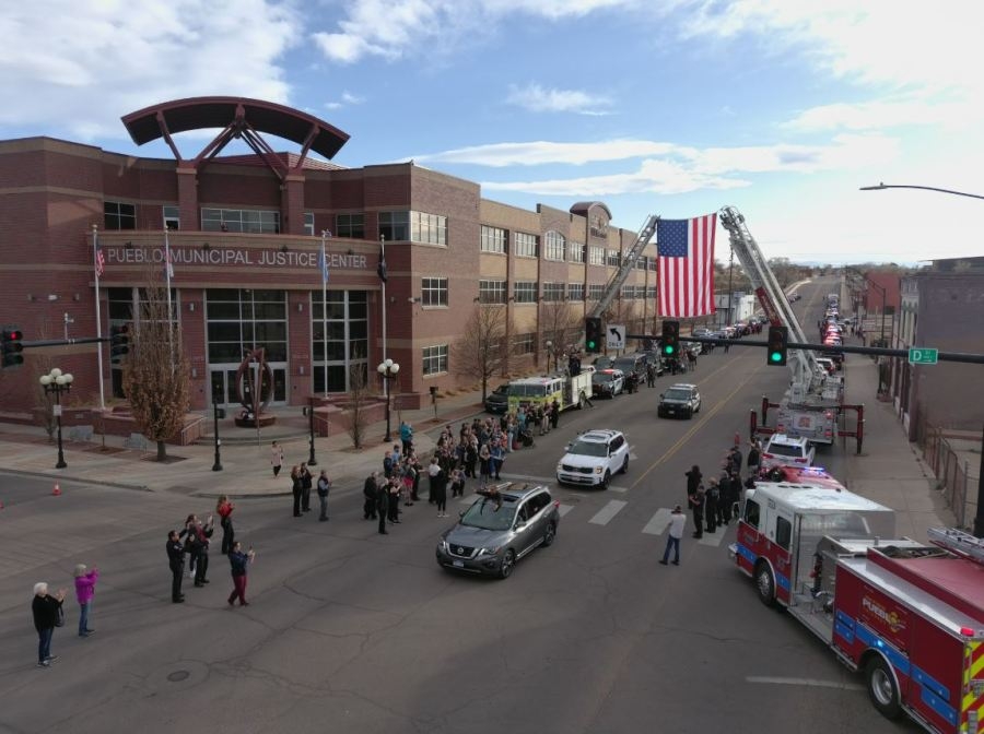 Pueblo officer injured in shooting returns home