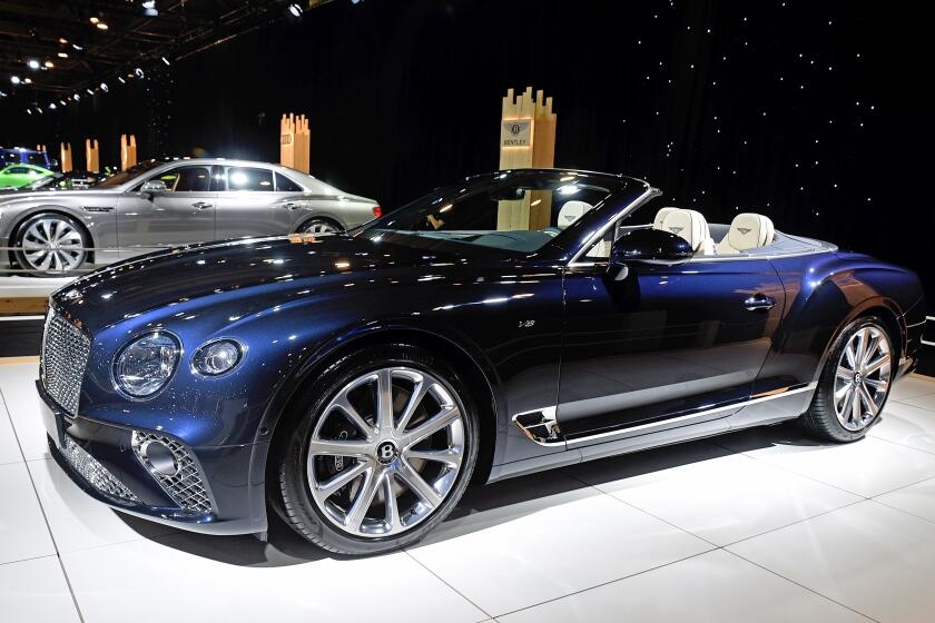Former LAPD reserve officer and his brother charged with insurance fraud over Bentley crash