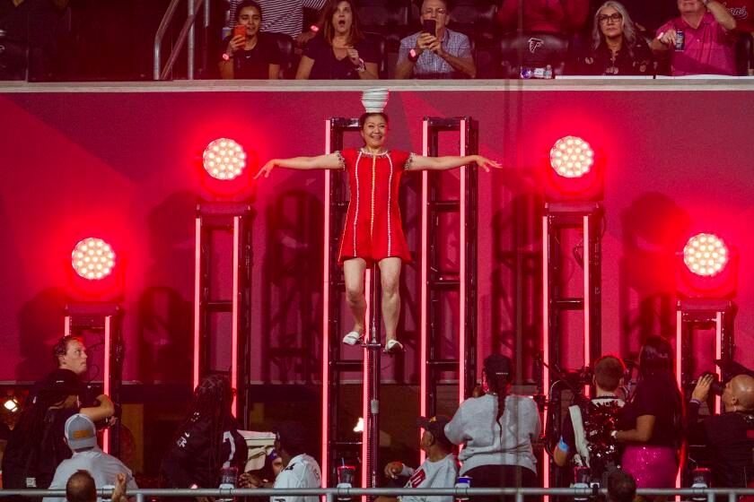 Acrobat Red Panda takes scary tumble from elevated unicycle during WNBA halftime show
