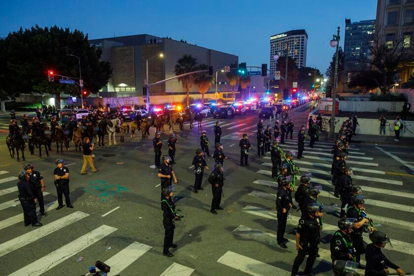 A tamer night in downtown Los Angeles as LAPD makes more arrests, enforces curfew