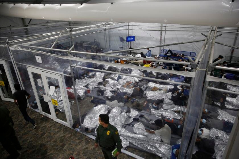 Migrant children languish in custody for months because of new federal rules, lawsuit says