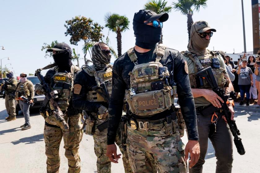 'Who are these people?' Masked immigration agents challenge local police, sow fear in L.A.