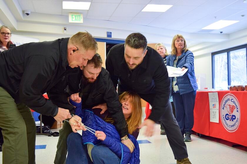 California security firm CEO, workers charged after woman forcibly removed from Republican town hall