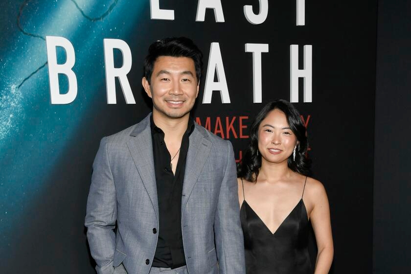 Simu Liu puts one of Shang-Chi's 10 rings on girlfriend Allison Hsu: They're engaged!