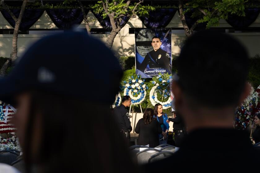 Baldwin Park mourns slain police officer at candlelight vigil