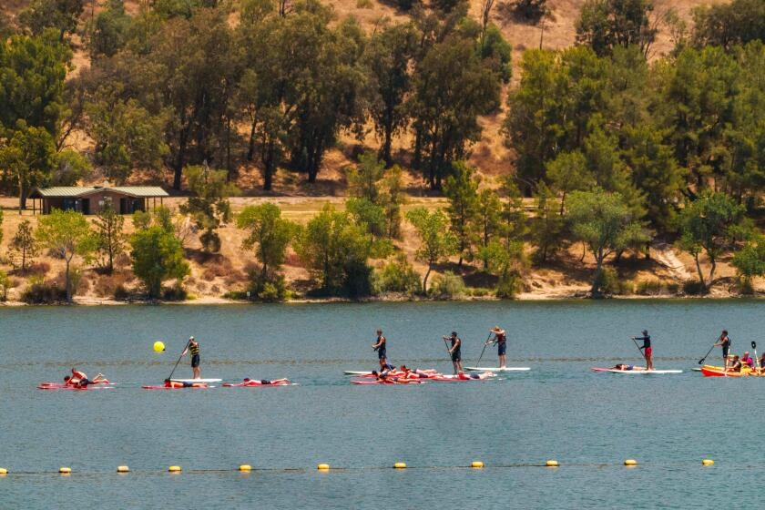 Divers search for kayaker on Castaic Lake after two flip over