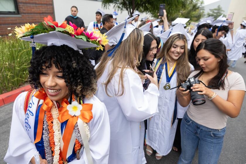Graduation day at Maywood Academy High, where students are 98% Latino; 100% All-American