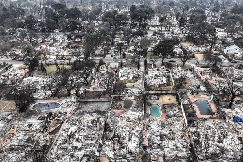 Power lines over Eaton Canyon saw surge in current before fire, Edison says