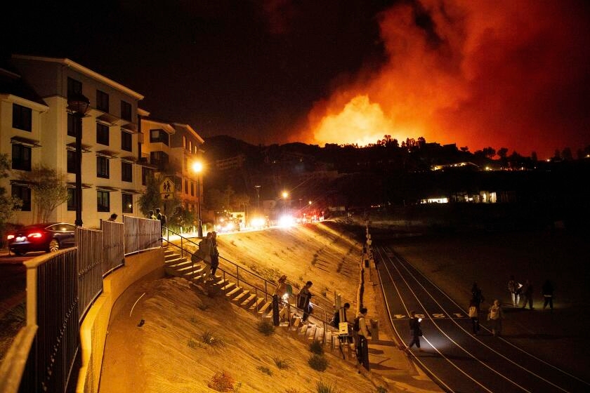 Wildfire explodes in Malibu, spurring mass evacuations and 'shelter-in-place' at Pepperdine University
