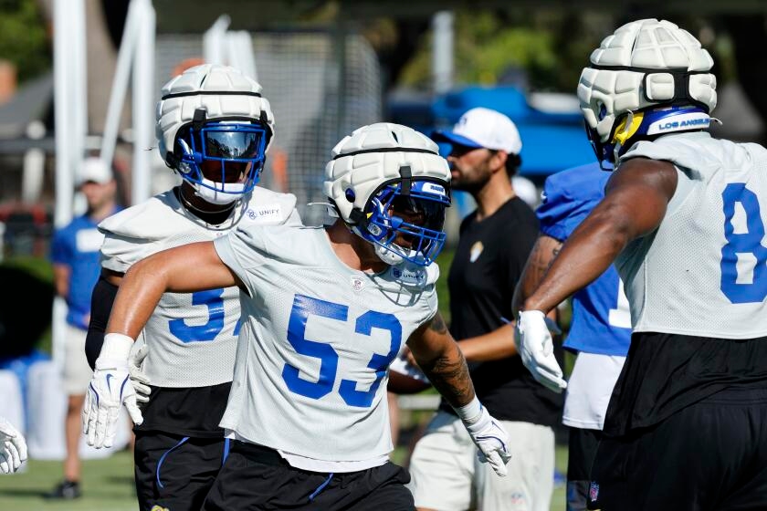 Rams linebacker Nate Landman wears his pride on body and helmet