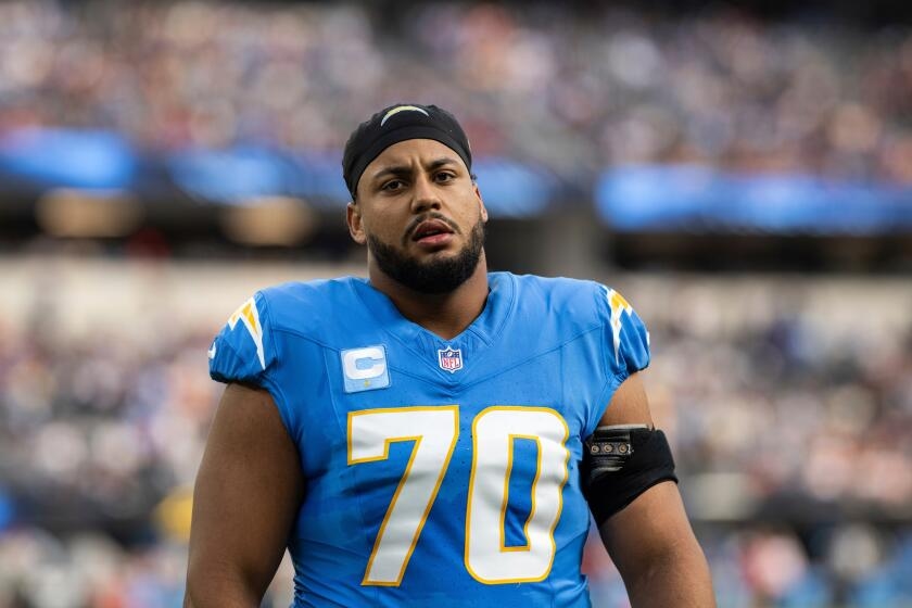 Chargers offensive lineman Rashawn Slater carted off with apparent leg injury
