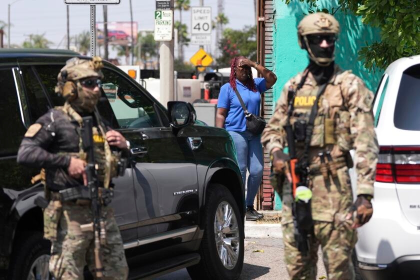 Immigration agent fires shots at vehicle with people inside in San Bernardino operation