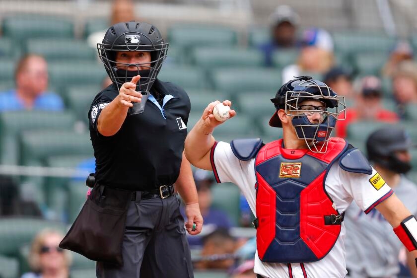 Jen Pawol praised for work behind plate after breaking MLB umpire gender barrier
