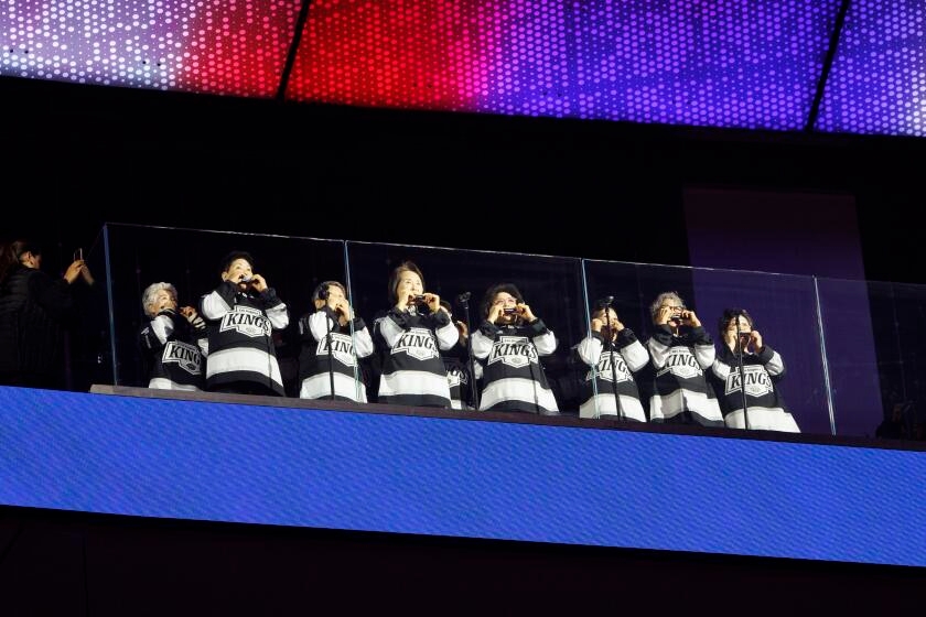 How Koreatown seniors have become Kings' playoff good luck charm with harmonica national anthem