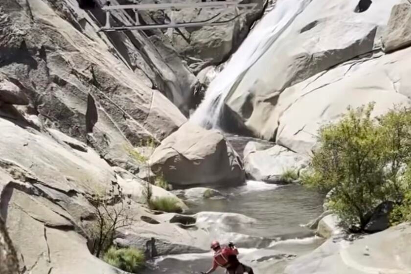 Man trapped behind a California waterfall for two days rescued "alive and well," officials say
