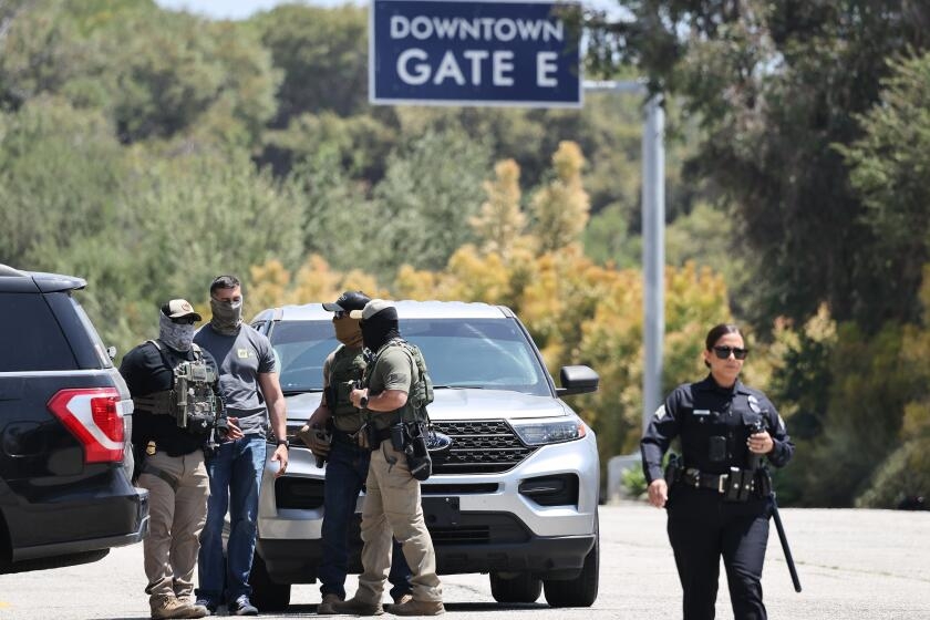 Contributor: By wearing masks, immigration agents undermine authority and endanger us all