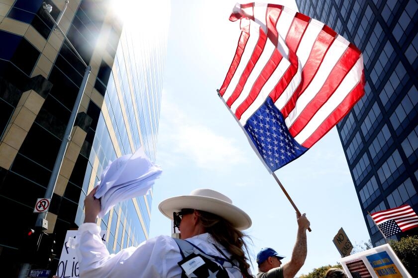 Hundreds rally against Trump, Musk in Westwood