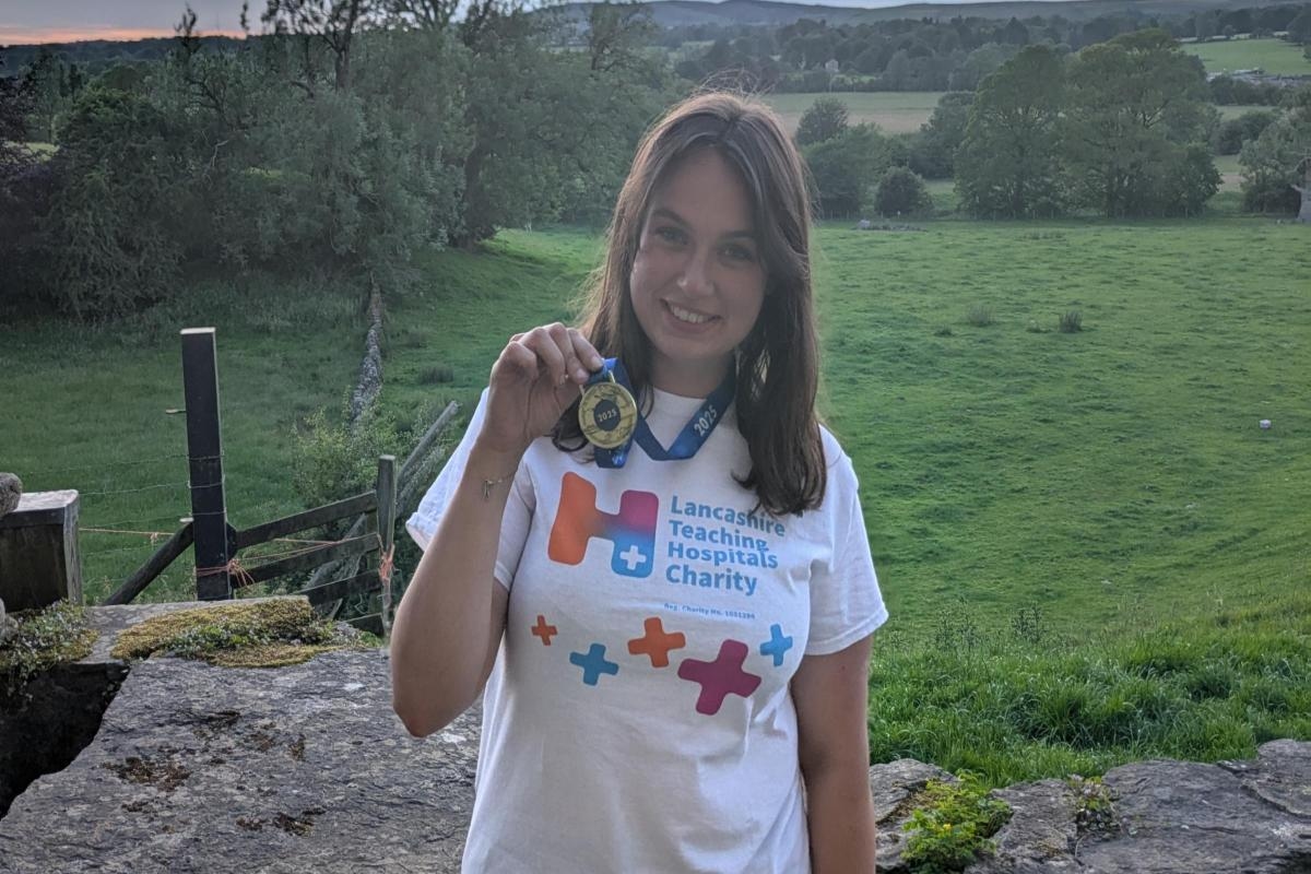 Ella takes on Windemere swim to raise £1,350 in memory of her dad