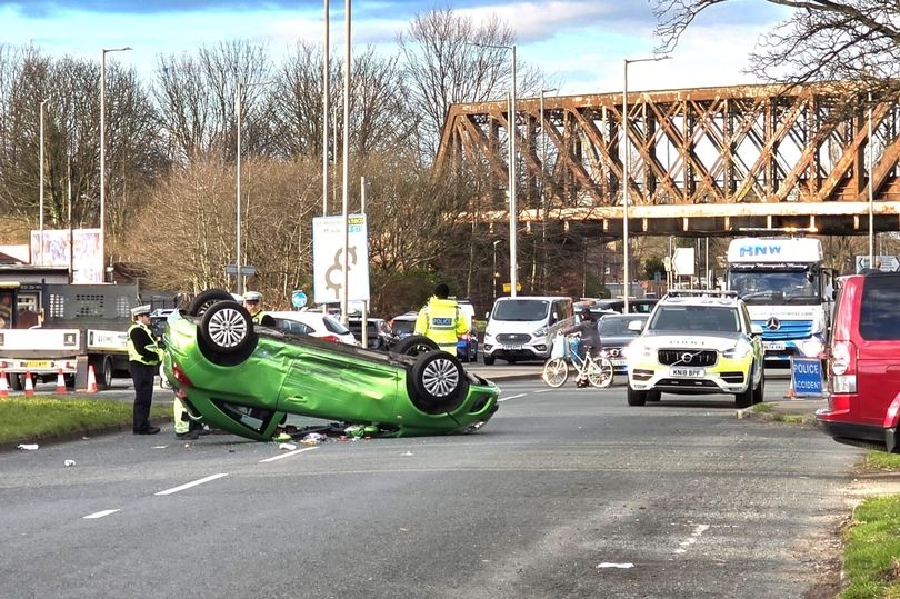 Car flips onto its roof after two-car crash on main road