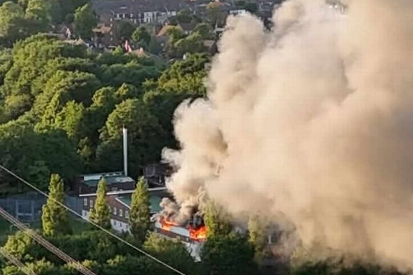 Children escape building fire as emergency services rush to scene