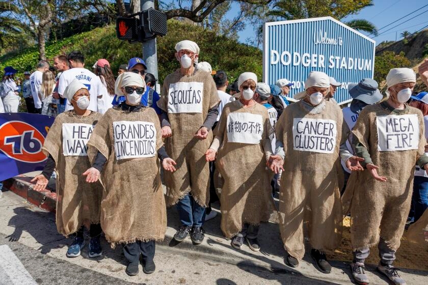 Letters to the Editor: The Dodgers' and Giants' Big Oil ads are just normal economic competition