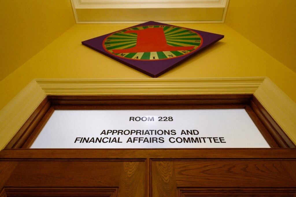 Committee approves stopgap biennial budget, adds funding for Medicaid and urgent needs