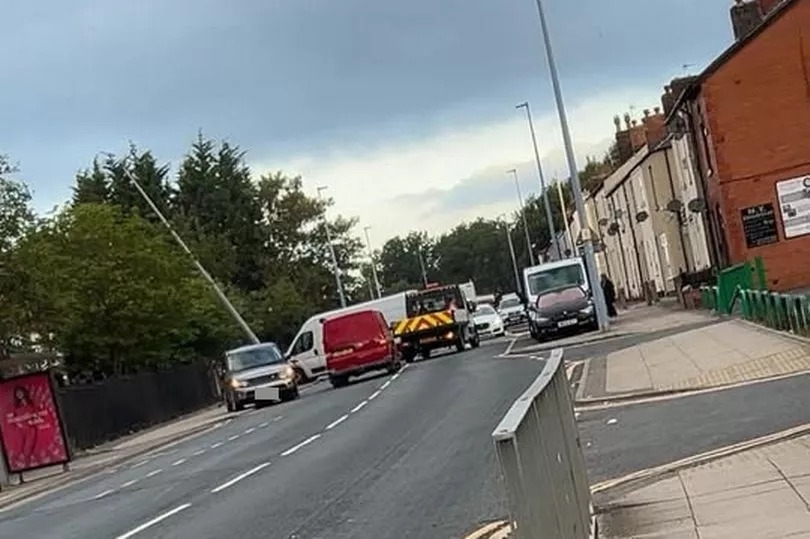 Woman rushed to hospital following crash on busy Greater Manchester road