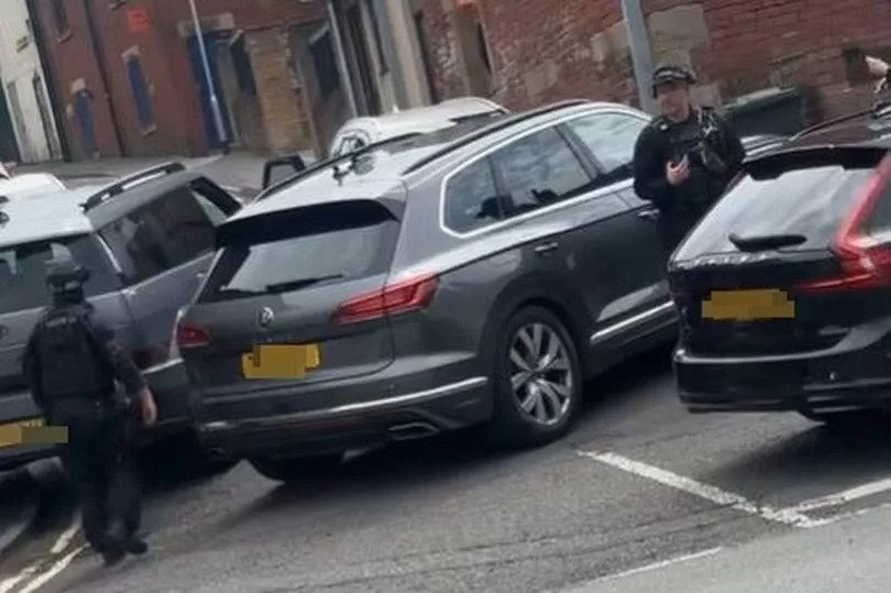 Armed police called and area taped off following reports of 'man with a gun'