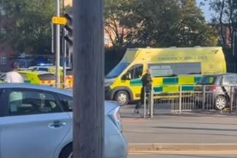 Police and paramedics block Hyde Road after crash