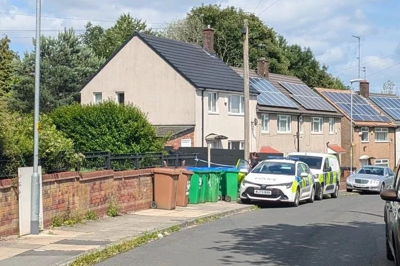Cordon in place and forensics scouring scene after shooting