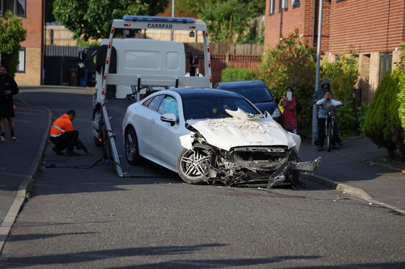 Woman taken to hospital after car crashes into house